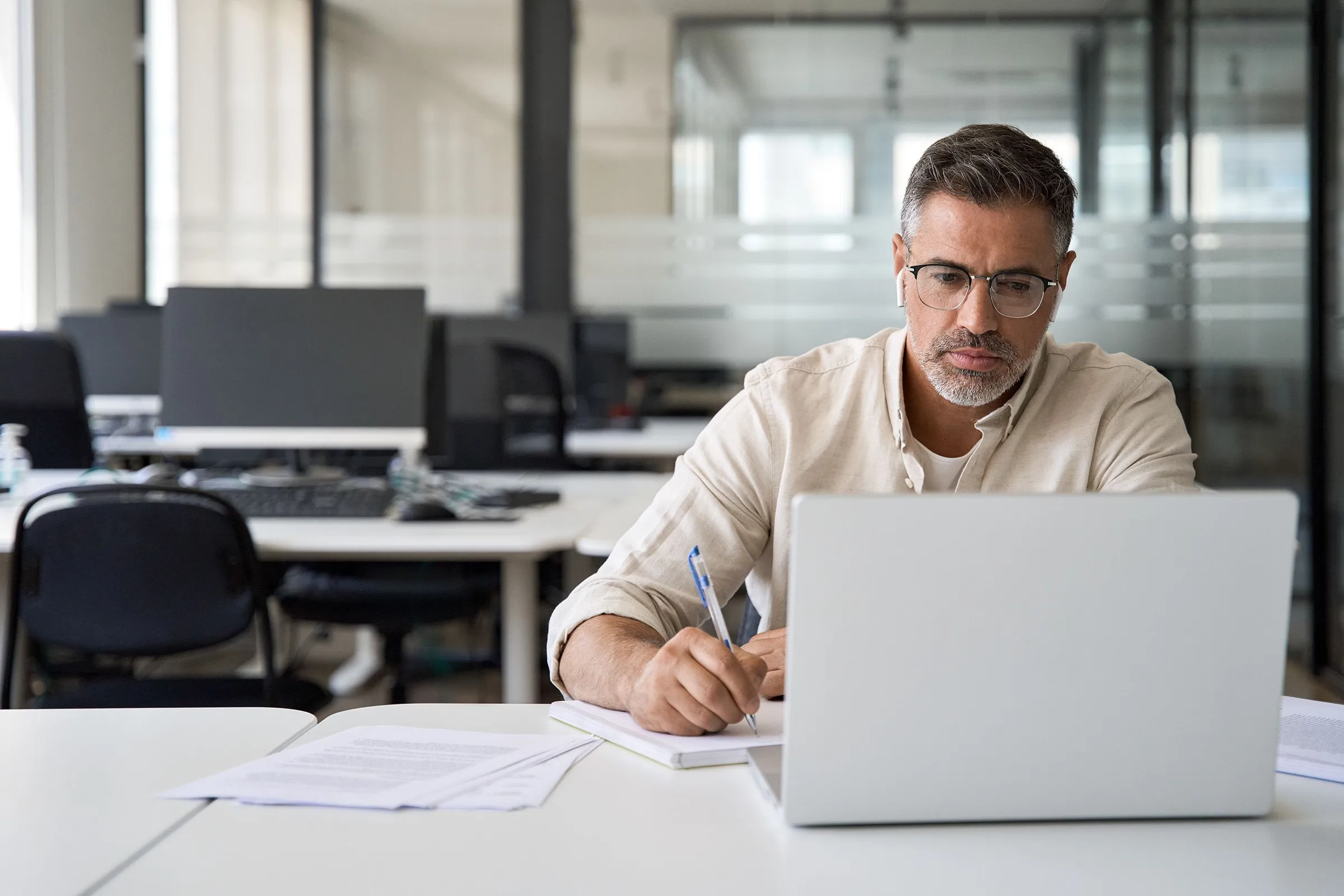 Learner working through an RDrive Academy course on a laptop at his own pace in a quiet office