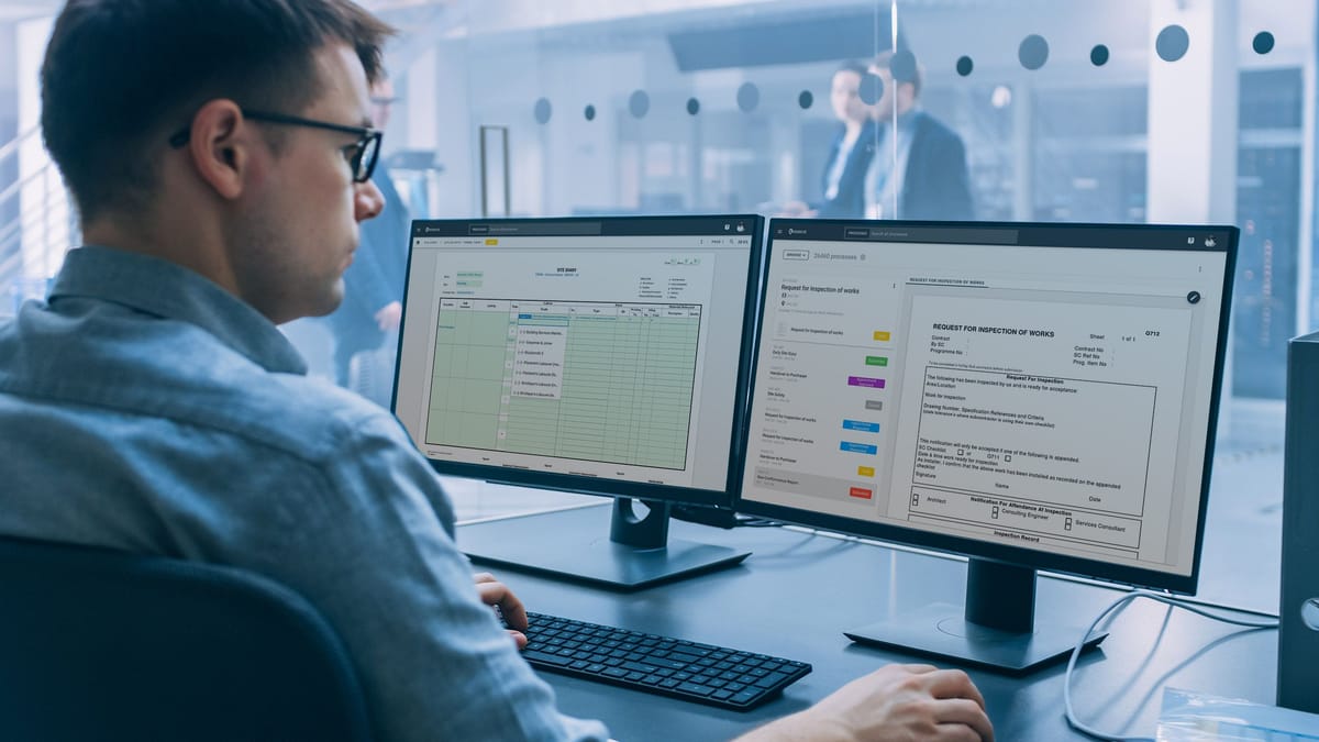 Engineer reviewing an inspection request and its data table across two monitors in RDrive Field