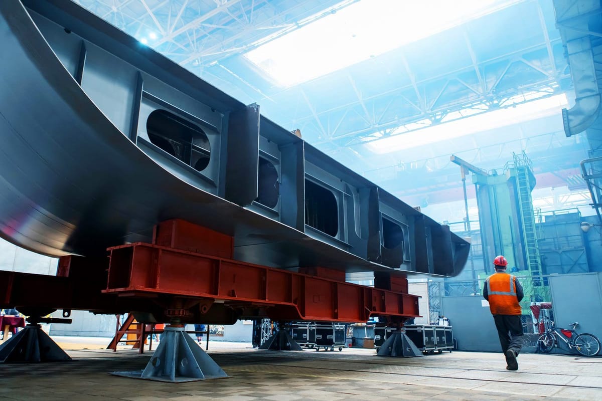 Large hull section under construction in a fabrication hall, one of the varied projects RDrive tracks